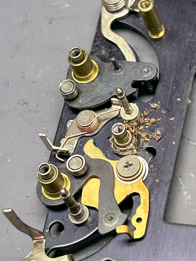 Close up of a Nikon FM2 shutter baseplate. Metal flakes are visible.