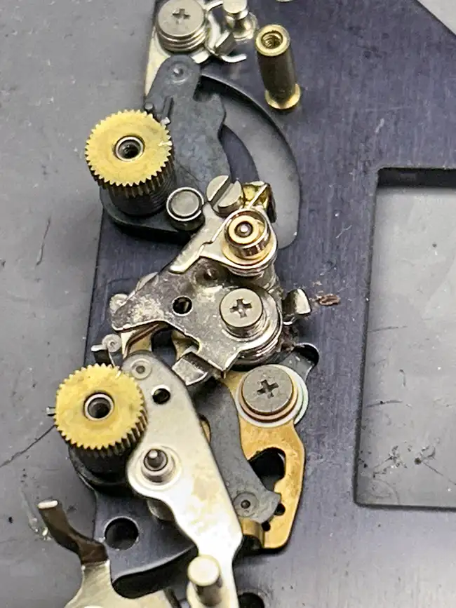 Close up of a Nikon FM2 shutter baseplate. Metal flakes are visible.